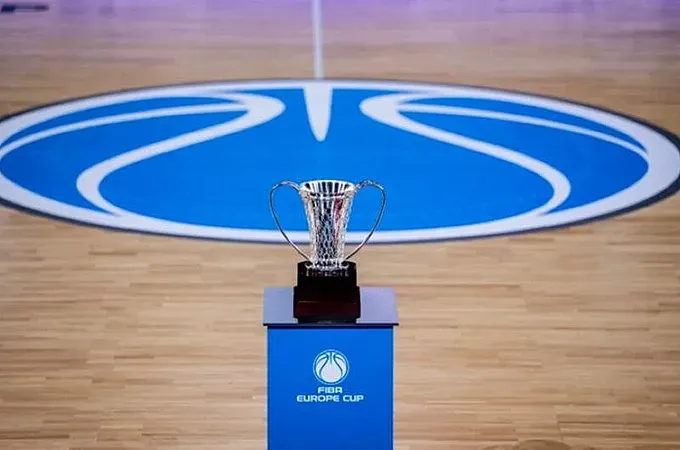 Silver trophy on a blue pedestal with the FIBA Europe Cup logo, on a wooden basketball court surface.